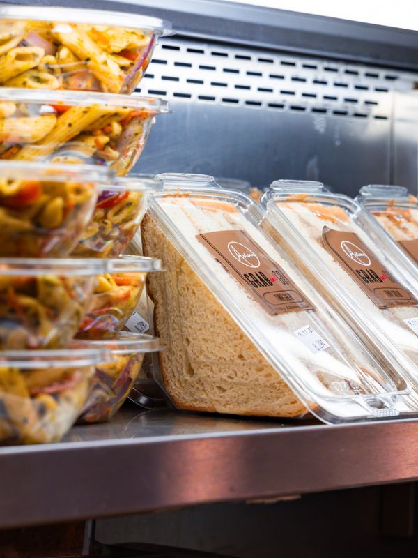 Grab and go smart cooler stocked with fresh sandwiches and snacks